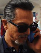 Benjamin Bratt wears a pair of black sunglasses in Episode 2 of the first season of Poker Face (2023).