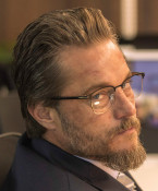 Travis Fimmel wears David Beckham DB 1059/F eyeglasses in the Black Snow series.