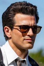 Paul Anthony Kelly as John F. Kennedy Jr. wears Moscot Frankie Sun in the FX series Love Story.