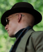 Eddie Redmayne wears Oliver Peoples Mandeville sunglasses in the series The Day of the Jackal.