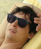 Julien Frison wears Ray-Ban RB2140 Wayfarer sunglasses in the movie Honeymoon Crasher.
