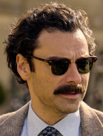 Aidan Turner wears Ray-Ban RB3016 Clubmaster Classic sunglasses in the series Rivals (2024).