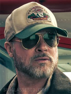 Brad Pitt wears Ray-Ban Outdoorsman sunglasses and Talkeetna Bush Pilot Hat in the 2026 movie Heart of the Beast.