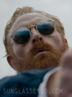 Kristofer Hivju wears gold Ray-Ban RB3637 New Round sunglasses in the Guy Ritchie movie In The Grey.