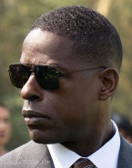 Sterling K. Brown is wearing black aviator sunglasses in the Hulu series Paradise.