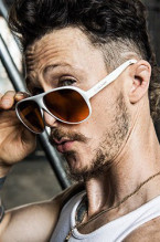 Jonathan Tucker as Jay Kulina wears white BluBlocker Original Aviator sunglasses in the series Kingdom