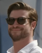 Liam Hemsworth wears Ray-Ban RB 2180 sunglasses in Lonely Planet.