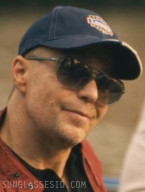 It looks like Sam Rockwell wears a pair of Ray-Ban RB2205 Bill sunglasses in The White Lotus Season 3.