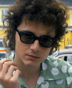 Timothée Chalamet as Bob Dylan wears vintage black Bausch & Lomb sunglasses in A Complete Unknown (2024).