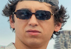 Marcello Hernández wears Miu Miu MU 11ZS sunglasses in the movie 72 Hours.