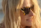 Mamie Gummer wears Tory Burch TY7201U sunglasses in the Amazon series We Were Liars.