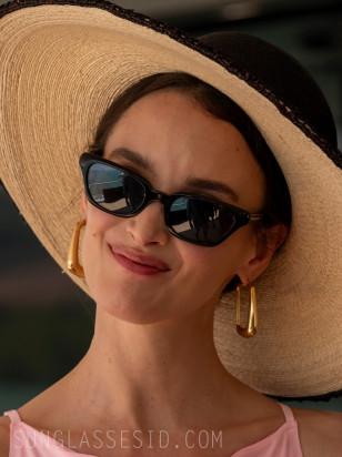 Charlotte Le Bon wears black Oliver Peoples 1983C sunglasses in The White Lotus Season 3.