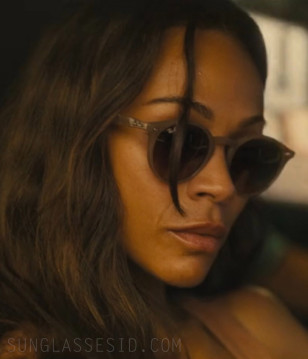 Zoe Saldaña wears Ray-Ban RB2180 sunglasses in Lioness (2024).