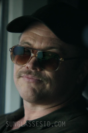 Luke Hemsworth wears Ray-Ban RB2205 Bill sunglasses in Episode 3 of The Terminal List: Dark Wolf.
