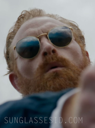 Kristofer Hivju wears gold Ray-Ban RB3637 New Round sunglasses in the Guy Ritchie movie In The Grey.