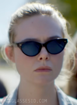 Elle Fanning wears black cat-eye sunglasses in the AppleTV+ series Margo's Got Money Troubles.