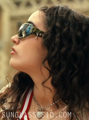 Asha Banks wears Justine Clenquet SSENSE Exclusive Khaki Jenny Camo sunglasses in Your Fault: London.