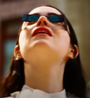 Emma Stone wears custom sunglasses in Poor Things.