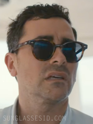 Dan Levy wears a pair of tortoise sunglasses in the series Big Mistakes.